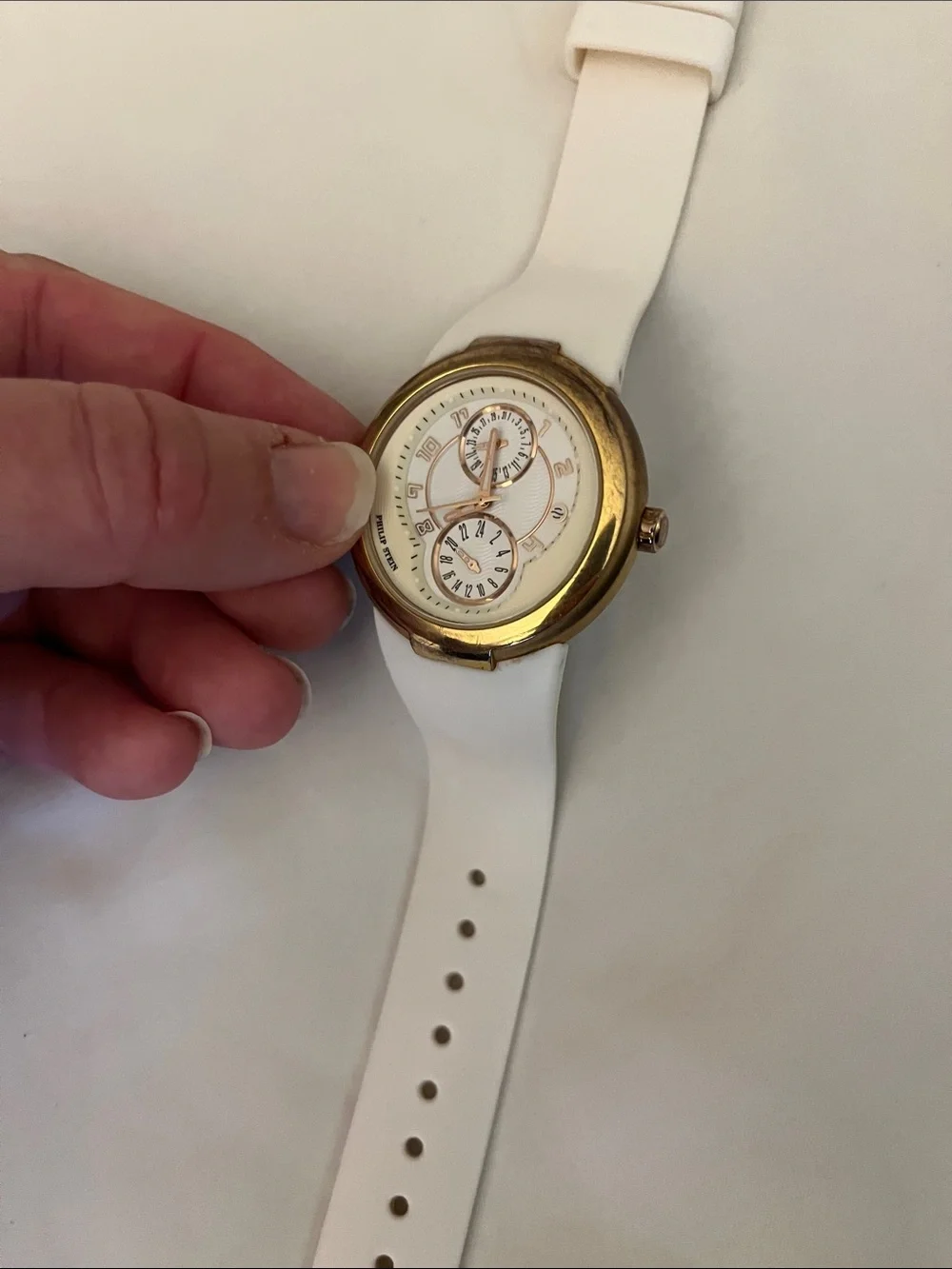 PHILIP STEIN gold bezel watch with white rubber strap (needs new battery)